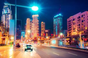 Cityscape with a sports car on the boulevard