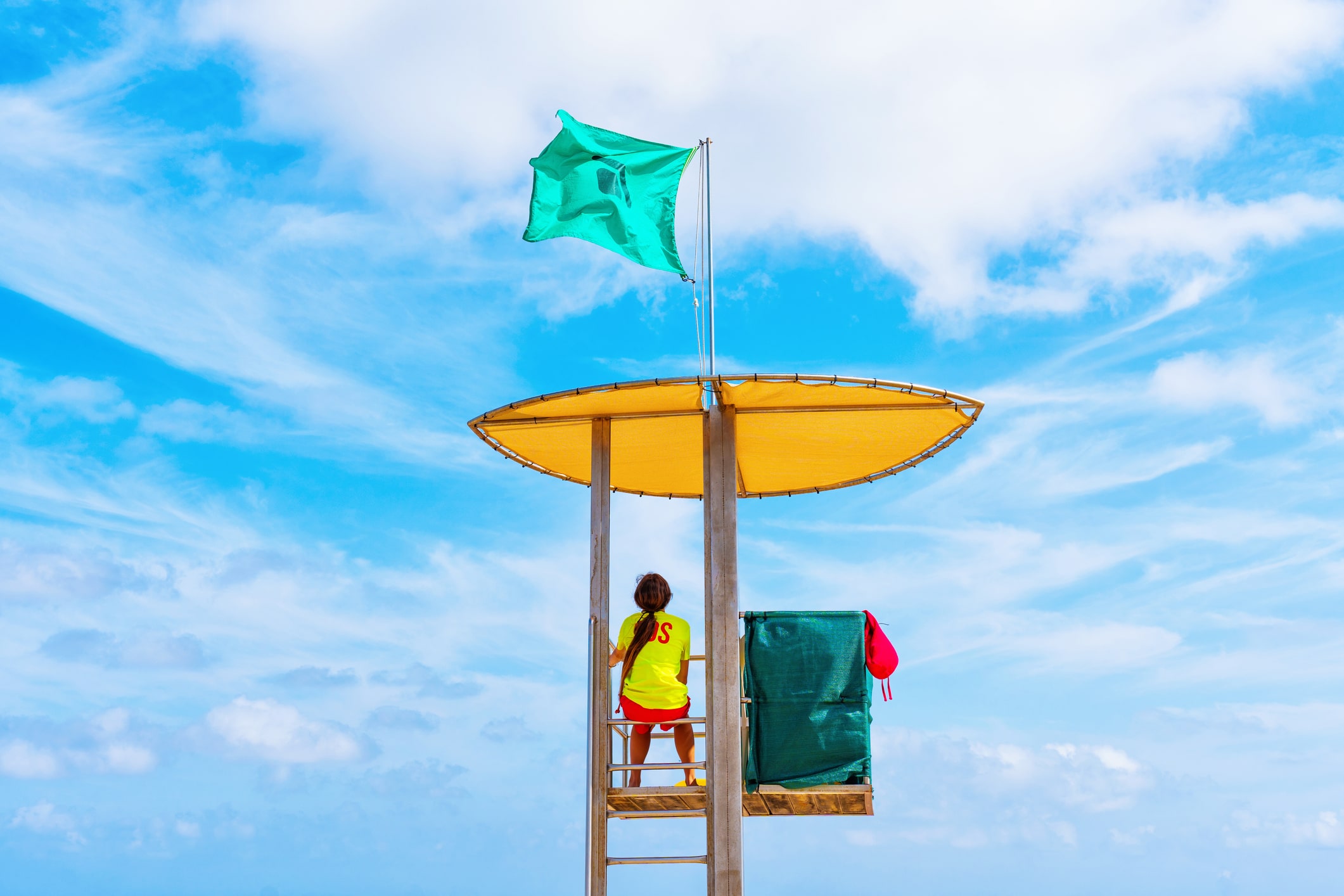 Lifeguard in a high tower on a beach