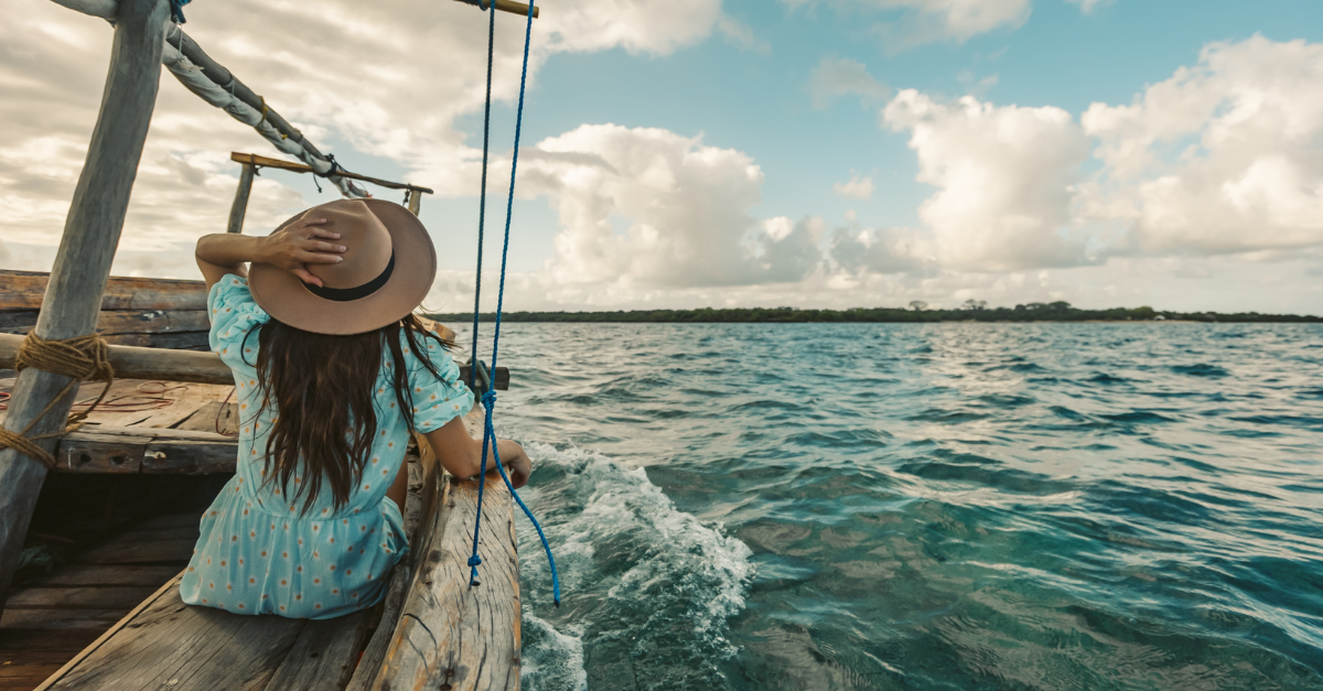 woman sailing on a wooden boat