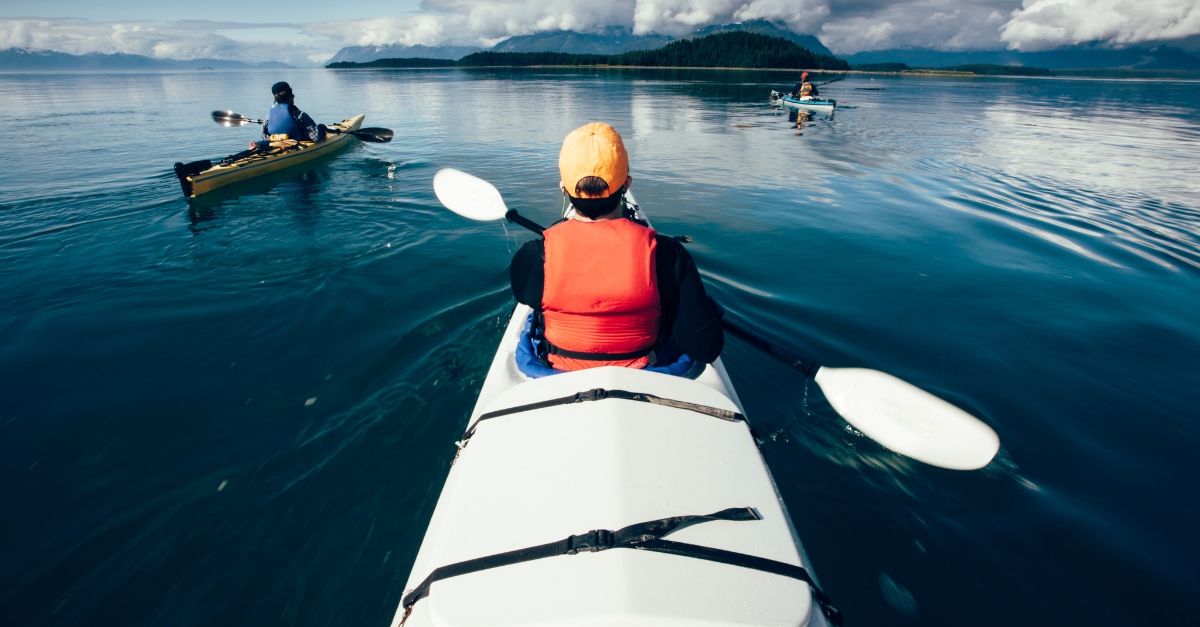 Sea kayakers paddling calm waters of Muir Inlet, Glacier Bay National Park, Alaska