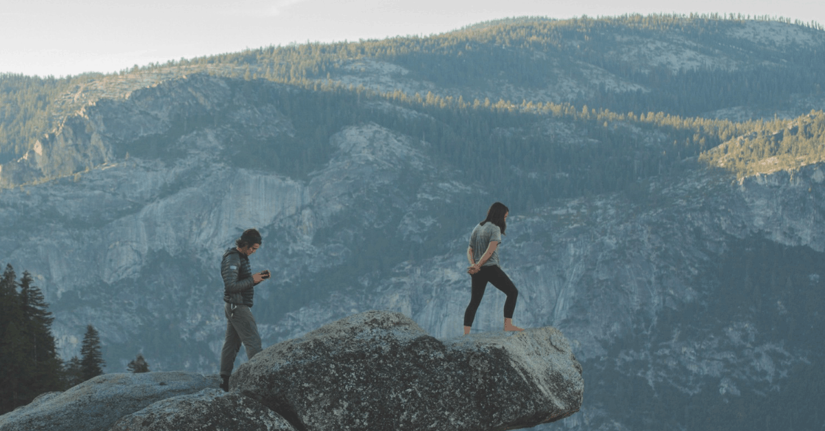 Woman Standing on Rock Formation